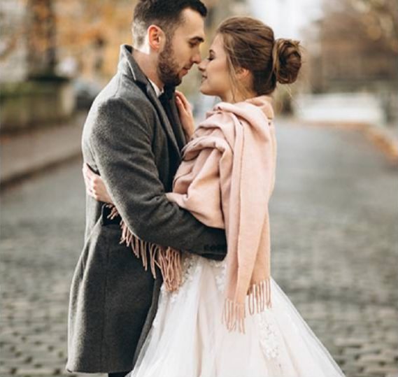 Couple embracing on an autumn street